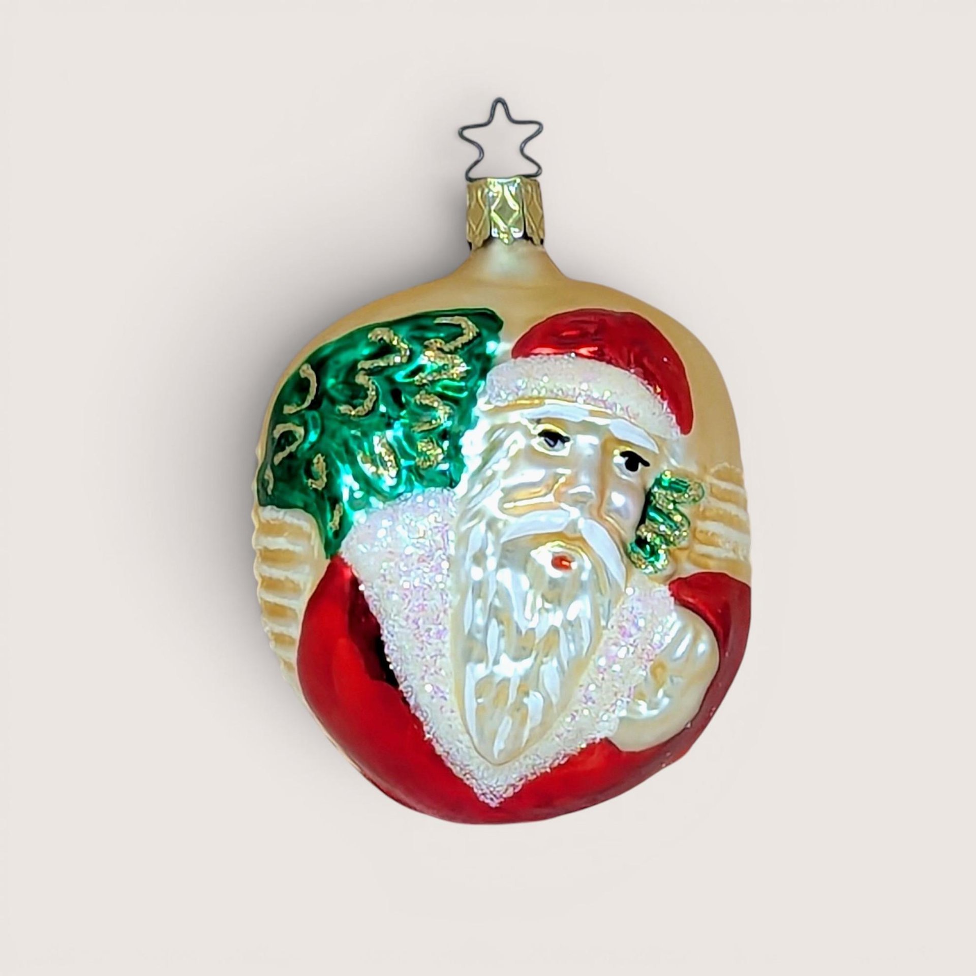 Vintage Old World Santa Inge-Glas blown glass Christmas ornament with star topper.