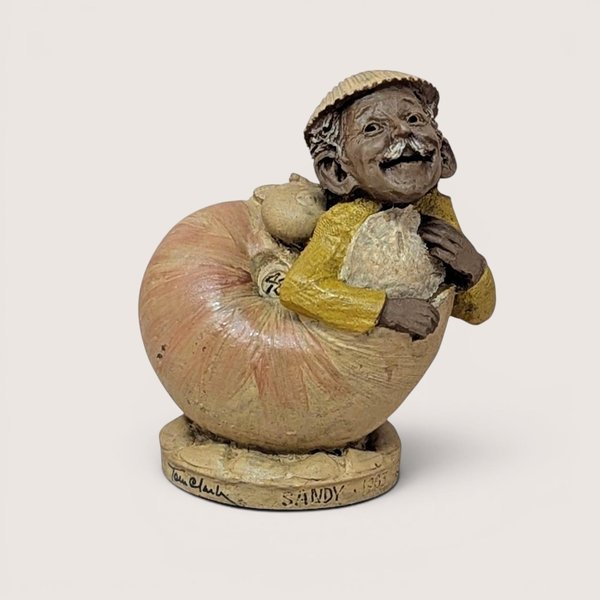Authentic 1983 signed Tom Clark resin gnome sculpture resting inside a detailed seashell.  