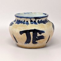 Handcrafted 1970s Senty studio pottery bowl featuring raw sand stoneware and bold cobalt blue abstract markings.