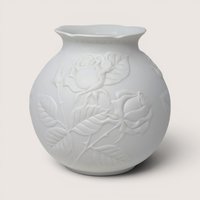 Vintage Kaiser white bisque porcelain vase featuring an embossed rose and foliage relief design.