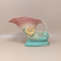 Vintage Hull Art Pottery cornucopia vase in the Waterlily pattern. Features a shaded pink-to-turquoise ombré matte glaze with an embossed yellow waterlily. 6.5 inches tall.