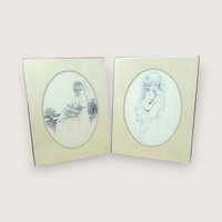 Pair of vintage 1975 Sharon Johnson prints. Fine charcoal-style drawings of a mother nursing a baby and a mother holding a child. Oval mattes on cream paper. 14x11 inches.