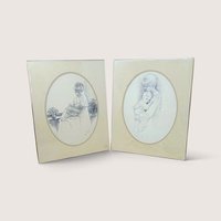 Pair of vintage 1975 Sharon Johnson mother and child pencil sketch art prints in oval mats.