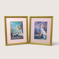 Pair of vintage 1930s framed prints by Zula Kenyon and Florence Lindsey. Features young girls in white dresses interacting with nature. Ornate gold wood frames with pink mats. 10.75 x 8.75 inches.
