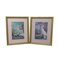 Pair of vintage 1930s framed prints by Zula Kenyon and Florence Lindsey. Features young girls in white dresses interacting with nature. Ornate gold wood frames with pink mats. 10.75 x 8.75 inches.