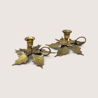 Pair of vintage brass leaf candlestick holders with finger rings made in India.