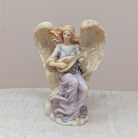 A vertical 7-inch resin figurine of a winged angel named Lydia. She wears flowing mauve robes and is depicted playing a lute-like instrument. The wings are highly detailed with a soft peach-cream finish. Includes original Roman Inc. gold tag.