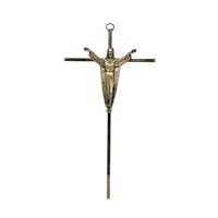 A vertical 10-inch brass crucifix wall hanging. Features a slender, modernist cross with a sculptural figure of the Risen Christ with arms outstretched. Aged brass finish with authentic patina.