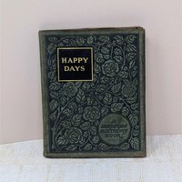 A small, 1904 leather-bound book titled "Happy Days: A Shakespeare Birthday Book." The dark cover is intricately embossed with a floral rose pattern and gold-foil lettering, showing a soft, aged patina on the edges.