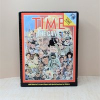 A vintage board game box for "TIME: The Game." The cover features a dense, colorful collage of historical figures from the 20th century, including JFK, Princess Diana, and an astronaut, set within a bold red and black border.