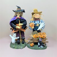 a photo of a fabric mache witch and scarecrow set with the text Scarecrow and Witch 13 inch Fabric Mache Figurines against a neutral background.