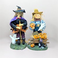 a photo of a fabric mache witch and scarecrow set with the text Scarecrow and Witch 13 inch Fabric Mache Figurines against a neutral background.