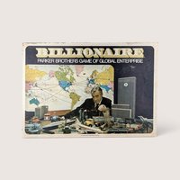 Vintage Billionaire board game box featuring a man in a suit surrounded by industrial toys and a world map.