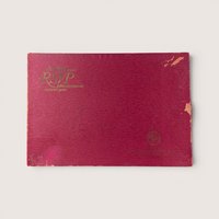 Vintage Scrabble RSVP crossword game box in a deep magenta hue with gold embossed lettering.