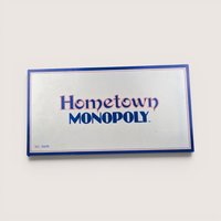 Vintage Hometown Monopoly Saint Paul MN board game box with a clean silver finish and bold blue and red lettering.