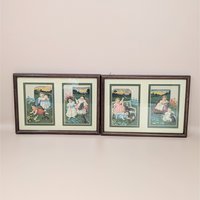 A set of two framed wall hangings, each containing two vintage-style advertising cards featuring Victorian children and puppies in pastoral outdoor settings.