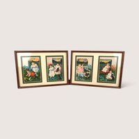 Set of two vintage framed sarsaparilla advertising cards with multi-print mats and dark wood frames.
