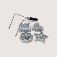 A vintage Nordic Ware kitchen tool set featuring a double metal handle and four cast aluminum molds in star, heart, flower, and square shapes.