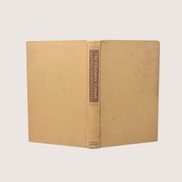 A vintage 1948 first edition hardcover of The Chocolate Cobweb by Charlotte Armstrong with a tan cloth cover and brown spine labelsA vintage 1948 first edition hardcover of The Chocolate Cobweb by Charlotte Armstrong with a tan cloth cover and brown spine labels