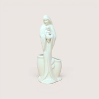 A white ceramic Madonna and Child planter figurine, centered on a beige background.