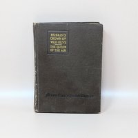 A 1918 Macmillan Pocket Classic edition of Ruskin's Crown of Wild Olive and The Queen of the Air with a dark brown textured cover and gold gilt lettering