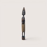 A slender, carved dark wood African style figurine with textured details, centered on a beige background.