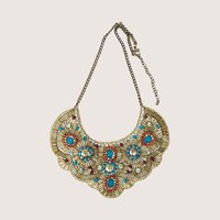 Intricate gold beaded bib necklace featuring turquoise, red, and blue accents with clear rhinestones.