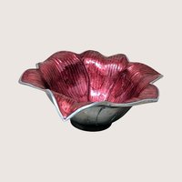 A sand-cast aluminum lily flower bowl with a glossy, jewel-toned raspberry pink enamel interior on a plain background.