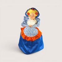 A vintage handmade tea cozy doll featuring a plastic face blonde braid and a large blue and orange fabric skirt