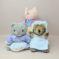 A 3-piece vintage plush set by Eden featuring Beatrix Potter characters: Pigling Bland in a pink jacket, Mrs. Tabitha Twitchit in a floral dress and apron, and Mrs. Tiggy-Winkle in a white cap and apron.