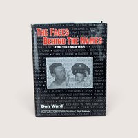 Hardcover book titled The Faces Behind the Names over a black dust jacket with military names and a central photo on a plain linen background.