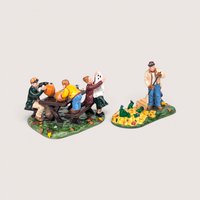 Department 56 ceramic Halloween figurine set featuring a family carving pumpkins and raking leaves.