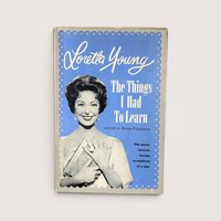 Vintage book cover of The Things I Had To Learn by Loretta Young featuring her portrait on a blue background.