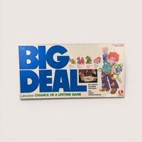 Vintage The Big Deal board game box in white with huge blue text and a colorful cartoon character holding cash.