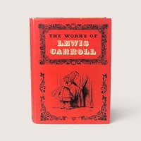 A vintage 1965 hardcover edition of The Works of Lewis Carroll with a vibrant red illustrated dust jacket.