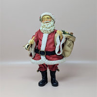 A vintage Santa Claus figure by Midwest Importers, standing 9.5 inches tall. He wears a red coat with white faux fur trim, carries a burlap sack, and holds a gold-tone bell in his hand.
