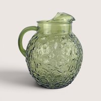 Vintage Anchor Hocking forest green textured glass pitcher with a curved handle and ice lip.