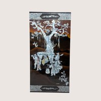 A large rectangular black lacquer wall panel featuring a detailed mother of pearl inlay scene under a large tree.