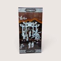 A large rectangular black lacquer wall panel featuring a detailed mother of pearl inlay scene with a grand gateway arch.