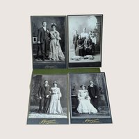 Four antique Victorian cabinet card portraits displayed on a soft pink background. The monochrome photographs feature formal wedding couples in period attire and a family group, with gold embossed studio text reading A. Gozanski West Superior WIS.