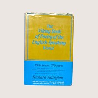 The vintage yellow and blue dust jacket of The Viking Book of Poetry anthology on a linen background