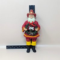 1990s Fabriche Fireman Santa Holding Wreath Figurine