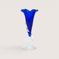 Vintage 1989 hand-blown cobalt blue art glass trumpet vase with a ruffled rim and an decorative clear glass looped stem.