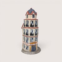 Vintage 1987 Department 56 The Tower Cafe porcelain Christmas village building with a rounded flatiron architectural shape.