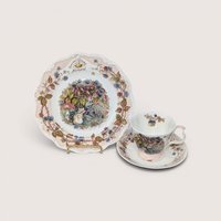 Royal Doulton Brambly Hedge Autumn plate alongside a matching tea cup and saucer on a plain background