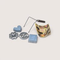 A vintage cast aluminum Nordic Ware double rosette and timbale iron set with interchangeable molds and a recipe booklet.