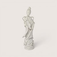 Vintage white ceramic Homco Quan Yin figurine standing on an ornate pedestal.