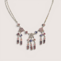 Vintage silver tone multi-color rhinestone chandelier necklace featuring pink and purple crystals.