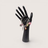 Y2K Victoria's Secret silver tone charm bracelet featuring iconic perfume and wing charms.