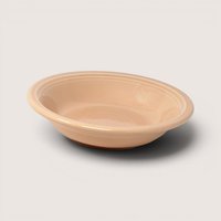 Vintage set of six peach glazed ceramic Fiesta small fruit or dessert bowls showing bottom maker's mark.